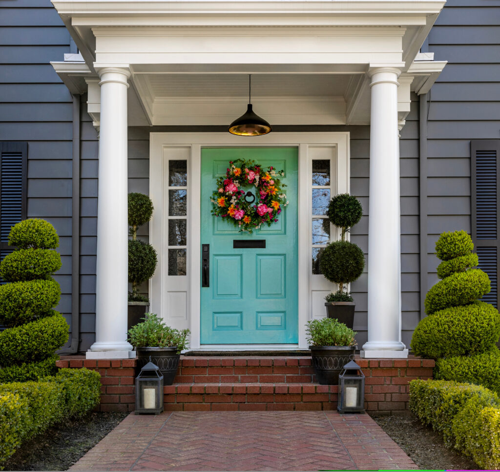 Beautifully,Decorated,Turquoise,Colored,Front,Door,Of,Traditional,Home.,Brick